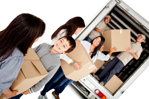 Professional house removals in Whitecity with packed boxes and moving team