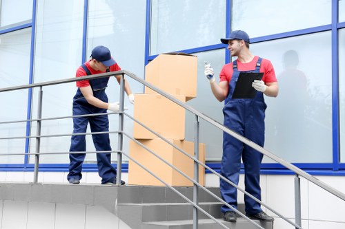 Removal team assisting with a home move in White City
