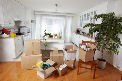 Packed boxes and furniture ready for a local move in White City