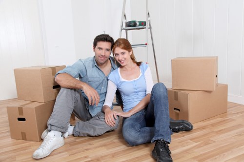 Professional movers handling office equipment during a Whitecity move